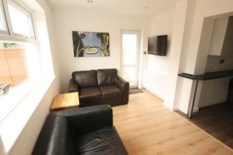 Bright and inviting living room featuring comfo...
