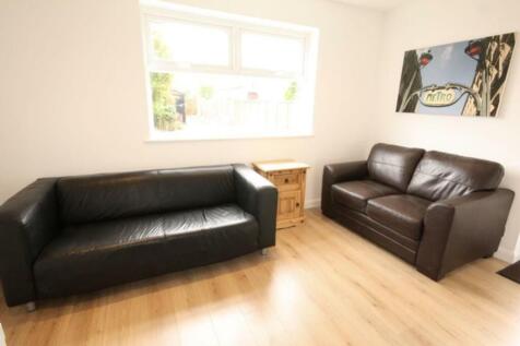 A cozy living room featuring two comfortable le...
