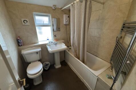 Bright and well-maintained bathroom featuring a...