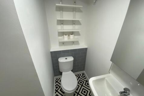 A stylish bathroom featuring modern fixtures an...