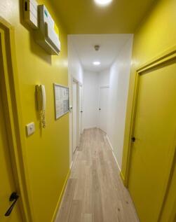 Bright and inviting hallway featuring modern de...