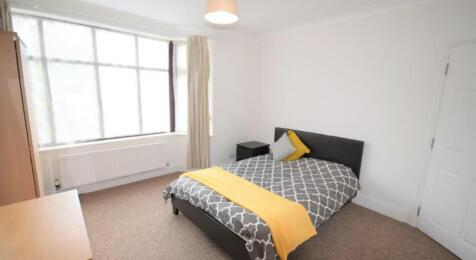 Bright and spacious double bedroom featuring la...