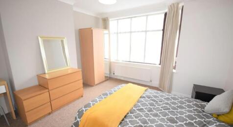 Bright and inviting double bedroom featuring la...