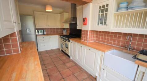 A charming kitchen featuring ample counter spac...