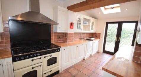 A charming kitchen featuring ample counter spac...