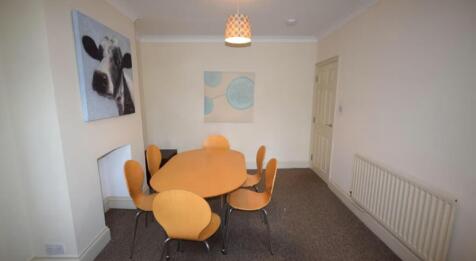 Bright and inviting communal lounge featuring a...