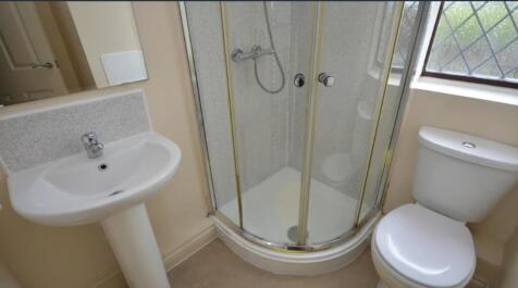 A well-maintained bathroom featuring a modern s...