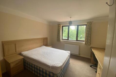 Spacious double bedroom featuring a comfortable...