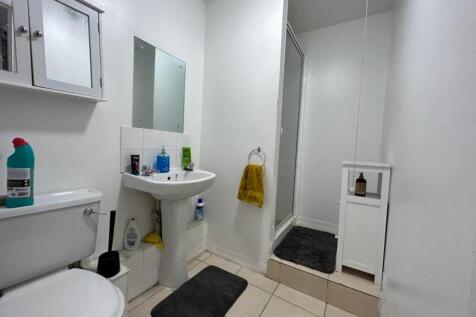 A bright and tidy bathroom featuring modern fix...