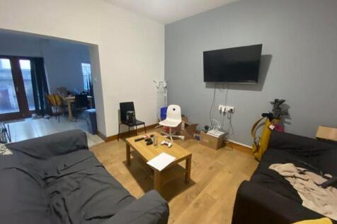 A spacious and inviting modern living room, per...