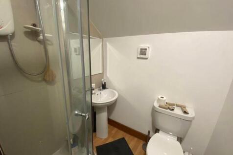 A tidy and functional bathroom featuring a mode...