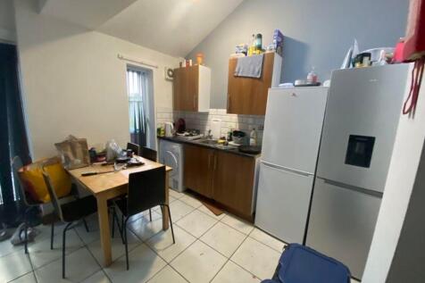 A functional kitchenette with ample storage and...