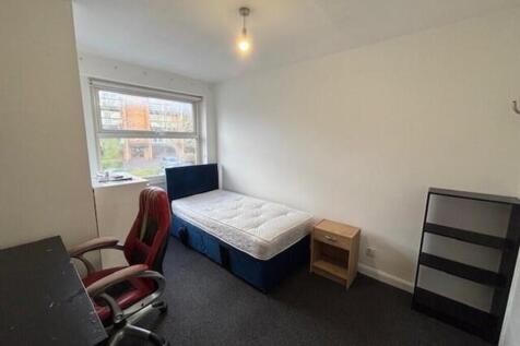 A bright and spacious double bedroom featuring ...