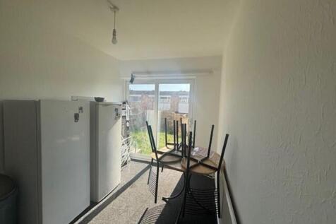 Bright kitchen space with ample storage and acc...