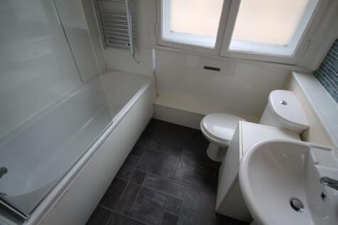 A clean and modern bathroom featuring a sleek d...
