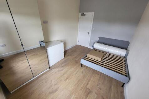 Spacious double bedroom featuring modern decor ...