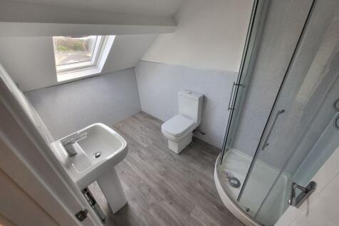 Modern bathroom featuring a sleek shower and co...