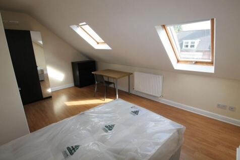 A bright and spacious double bedroom featuring ...