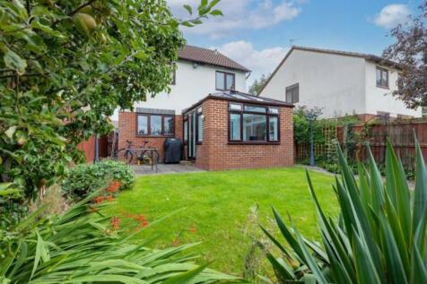 A beautifully maintained garden featuring lush ...