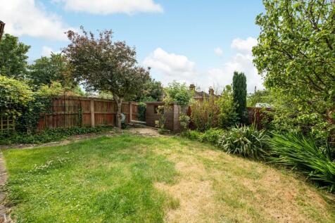 A beautifully maintained garden featuring lush ...