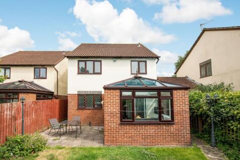 A charming garden area featuring a spacious pat...