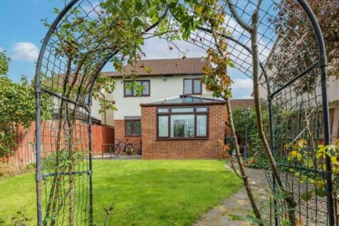 A beautifully maintained garden featuring lush ...