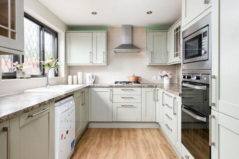 A beautifully designed kitchen featuring modern...