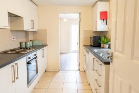 Modern kitchen equipped with essential applianc...