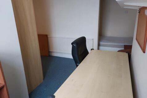 This spacious communal workspace features a fun...