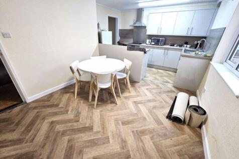 A bright and functional kitchen featuring a sty...