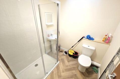 Bright and modern bathroom featuring a spacious...