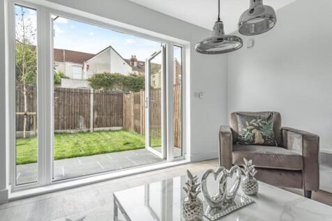 Bright and spacious living room featuring moder...