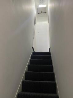 A well-maintained staircase leading to the uppe...