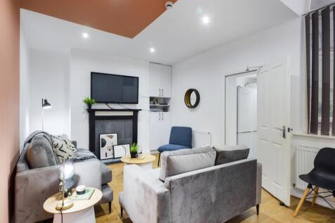 A spacious and stylish living room with modern ...