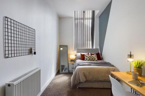 A bright and inviting double bedroom featuring ...