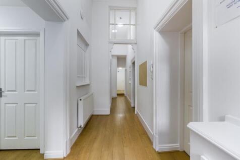 A bright and well-maintained hallway that welco...