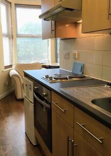Bright and modern kitchen equipped with essenti...