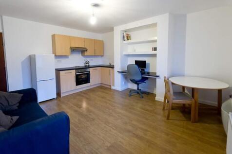 Spacious and well-lit kitchen area featuring mo...