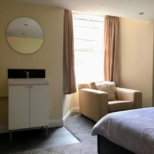 A beautifully designed double bedroom featuring...
