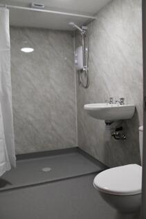 A modern bathroom showcasing sleek design with ...