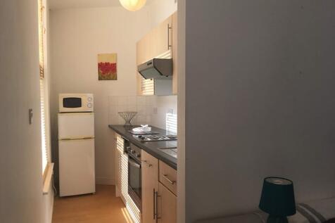 A cozy kitchen area featuring modern appliances...