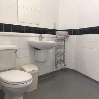 A well-maintained bathroom featuring modern fix...