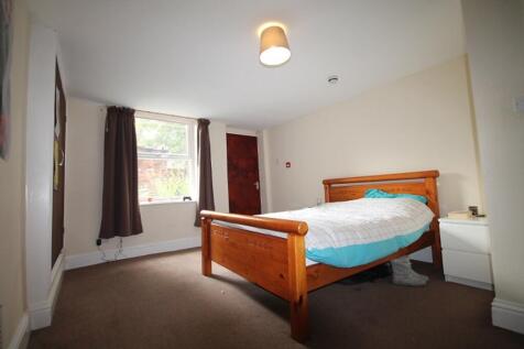 Spacious double bedroom featuring a comfortable...