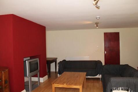 Spacious living area featuring a cozy atmospher...