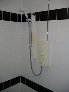 A well-maintained shower area featuring modern ...