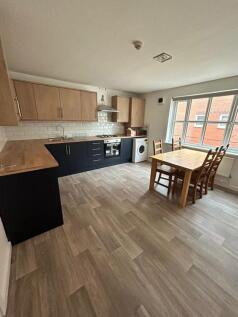 Spacious kitchen featuring modern cabinetry and...