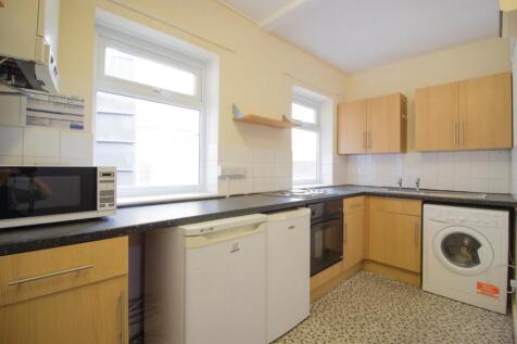 A well-equipped kitchen featuring modern applia...