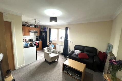 A cozy living room featuring a comfortable seat...