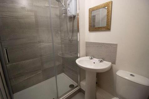 A modern bathroom featuring a sleek shower setu...