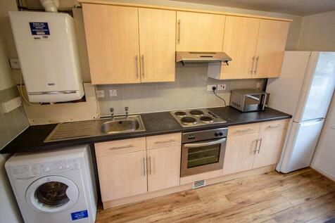 Bright and modern kitchen featuring ample stora...
